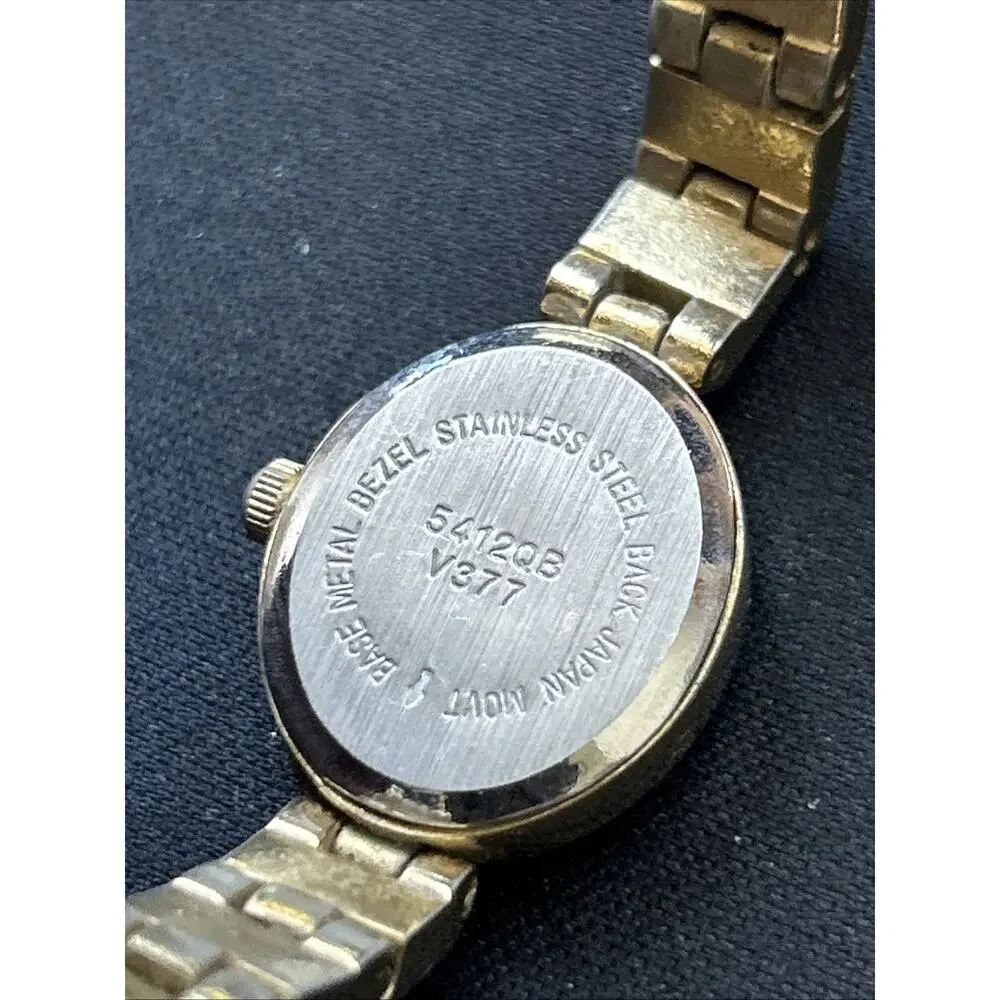 Gold Tone Oval Case Women’s Stretch Band Quartz Watch
